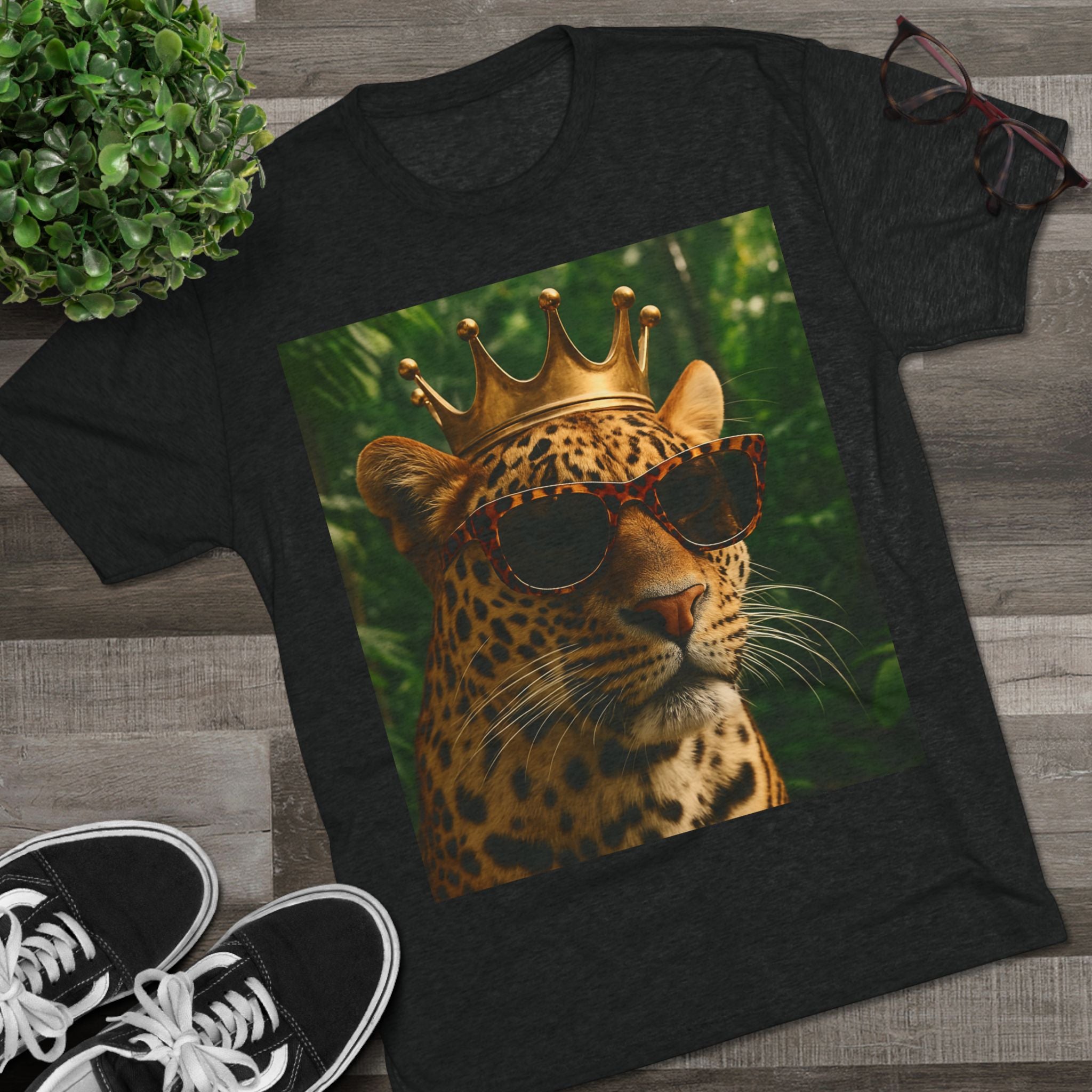 Jaguar wearing a gold crown and sunglasses in a jungle setting, symbolizing confidence, empowerment, strength, and royalty.